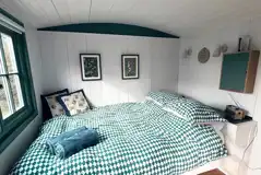 Oak shepherd's hut double bed with bedding provided at Stubbs Bridge Woodland Oak shepherd's hut double bed with bedding provided at Stubbs Bridge Woodland