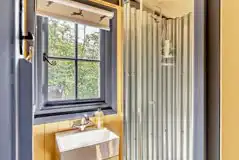 Oak shepherd's hut shower room