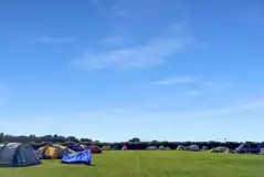 Spacious grass pitches at Snettisham Meadows