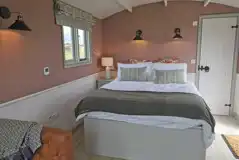 Shepherd's hut interior with double bed