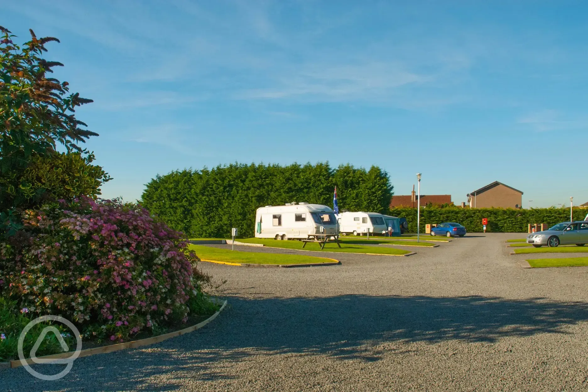 Hardstanding with grass pitches (optional electric)