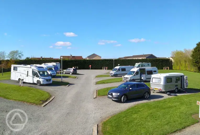 Hardstanding with grass pitches (optional electric)