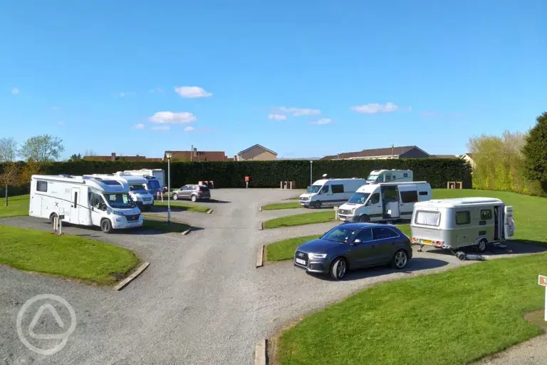 Hardstanding with grass pitches (optional electric)