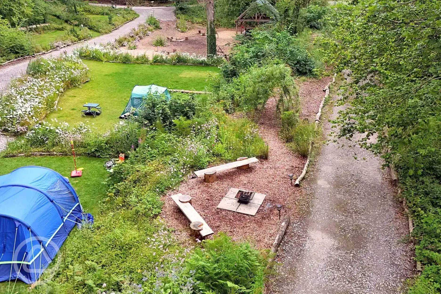 Non electric grass pitches with a fire pit area