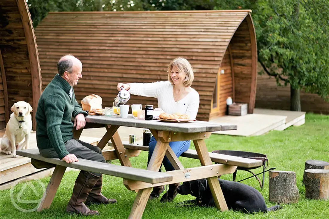 Seating outside the deluxe ensuite Wigwams