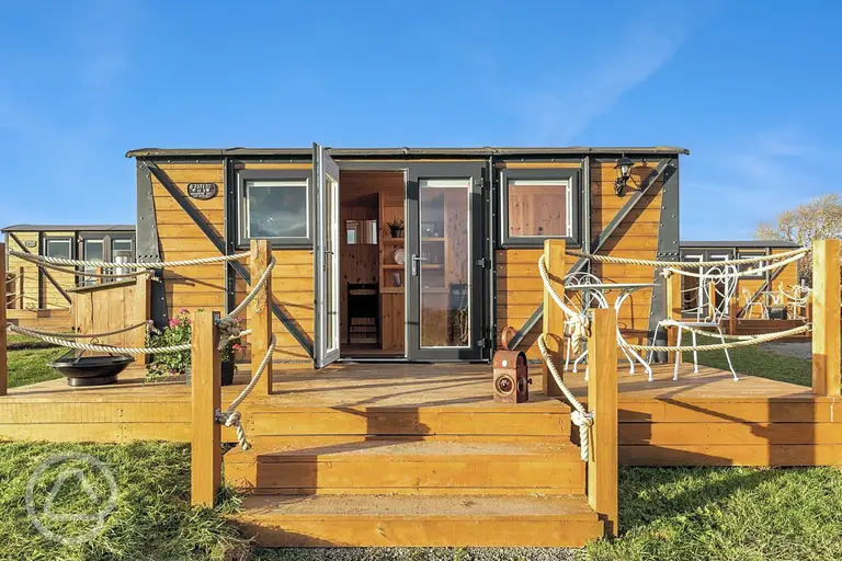 Railway wagons with raised deck areas and outdoor seating