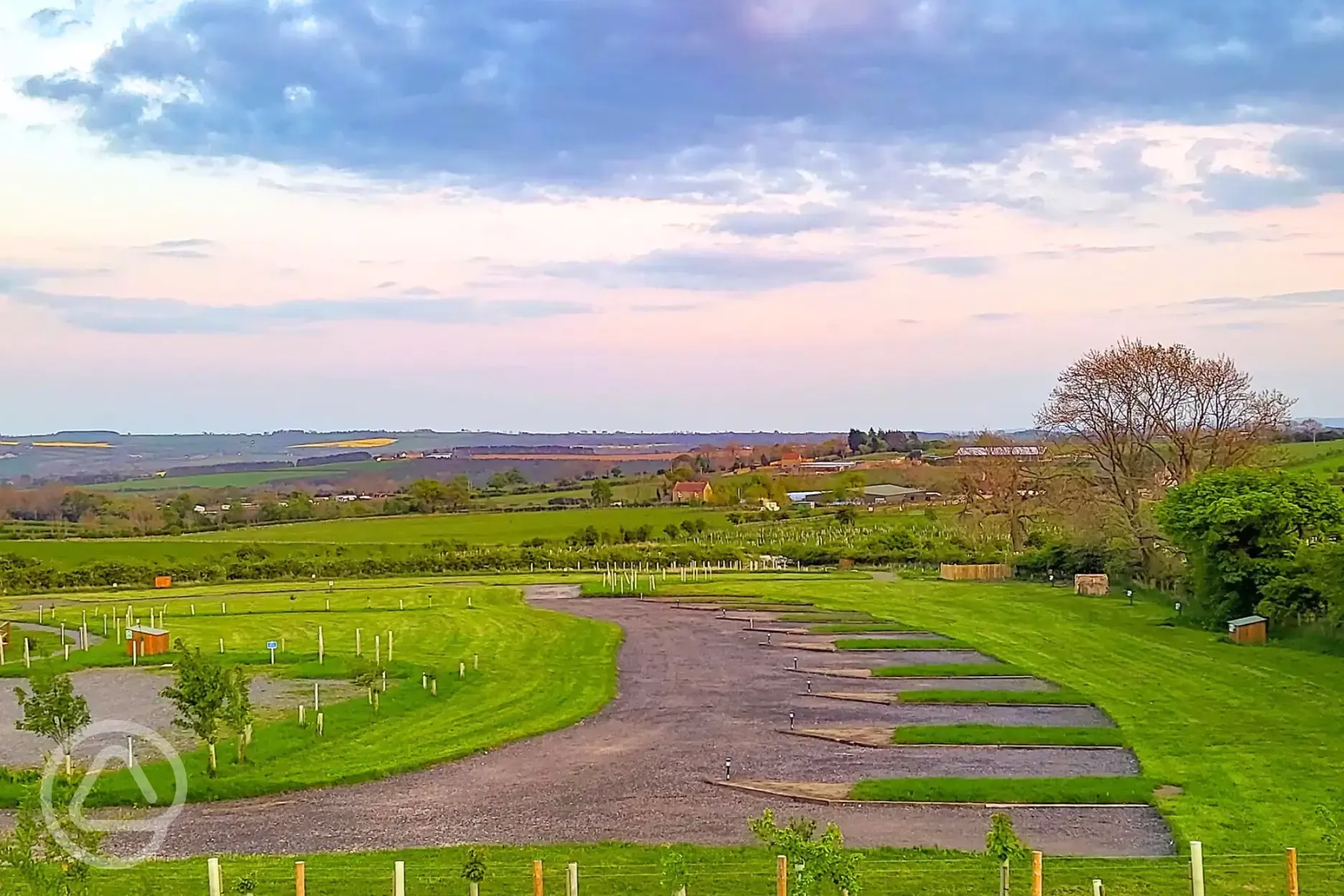 Electric hardstanding touring pitches at sunset