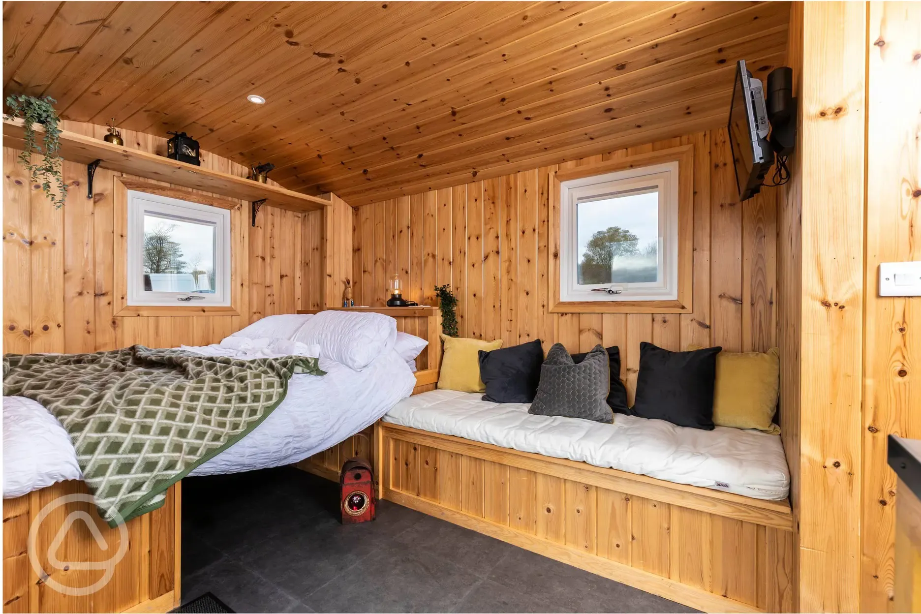 Railway wagon with a double bed (bedding included) and sofa bench