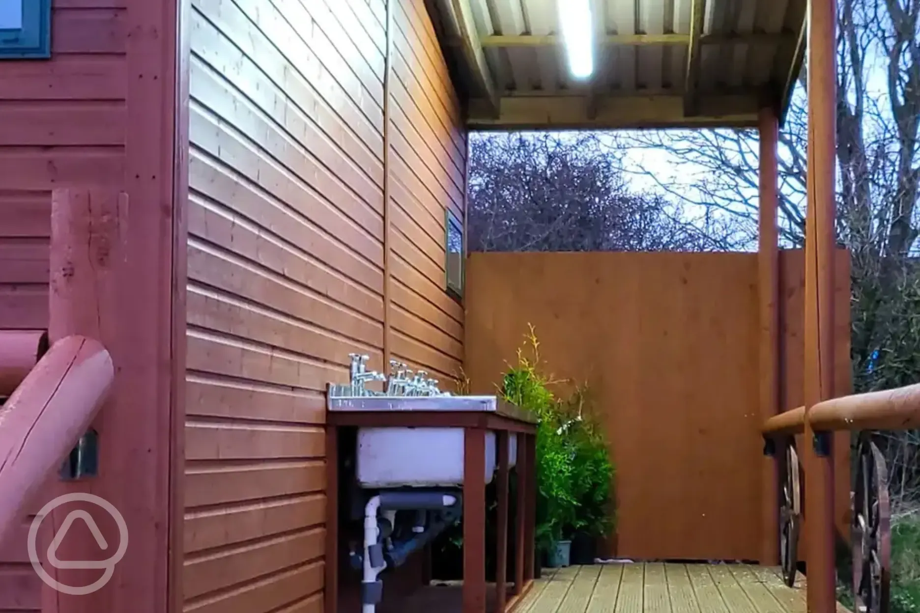 Covered outdoor washing up area