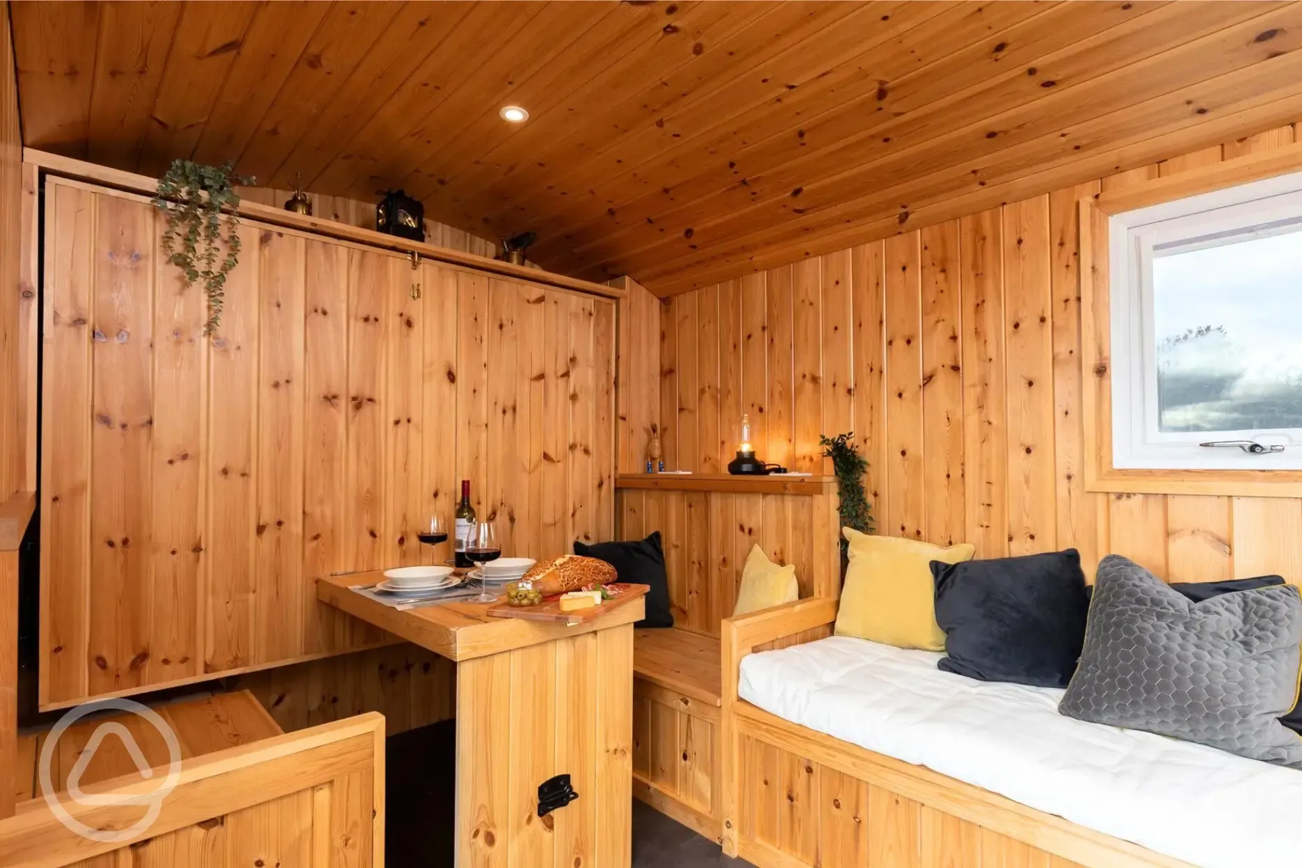 Railway wagon folding down bed with a seating area beneath