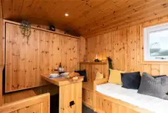 Railway wagon folding down bed with a seating area beneath