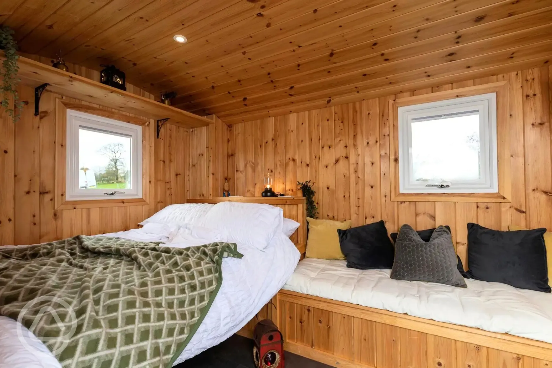 Railway wagon with a double bed (bedding included) and sofa bench