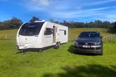 Grass pitches at Swallow Bach with parking alongside