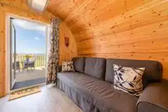 Glamping pod double sofa bed for kids, with two sleeping bags provided