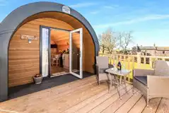 Bluebell glamping pod exterior with private decking area and outdoor seating