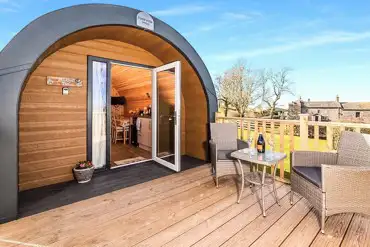 Bluebell glamping pod exterior with private decking area and outdoor seating