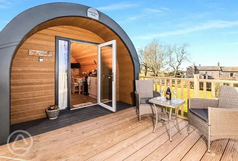 Bluebell glamping pod exterior with private decking area and outdoor seating