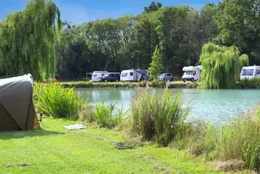Waterside fully serviced hardstanding touring pitches with 16 amp hook up