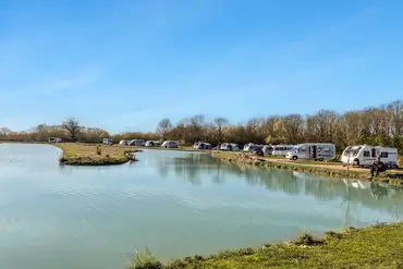 Waterside fully serviced hardstanding touring pitches (12m x 12m)