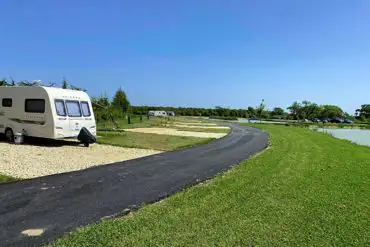 Waterside fully serviced hardstanding touring pitches