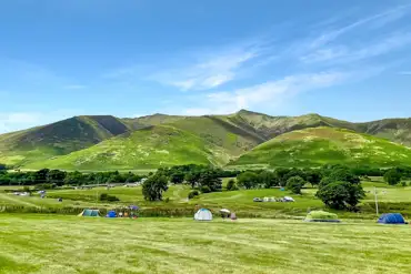 Non electric grass pitches with views of the Lake District National Park