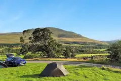 Non electric grass pitches suitable for tents and allowing up to four guests