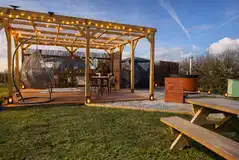 Glamping dome with a wood-fired hot tub