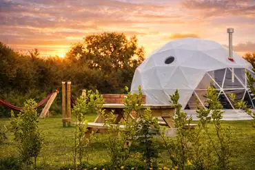 Dome at sunset at Grass Roots Caravan Glamping and Alpaca Trekking