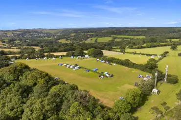 Aerial of the camping with grass pitches and a dividing hedge