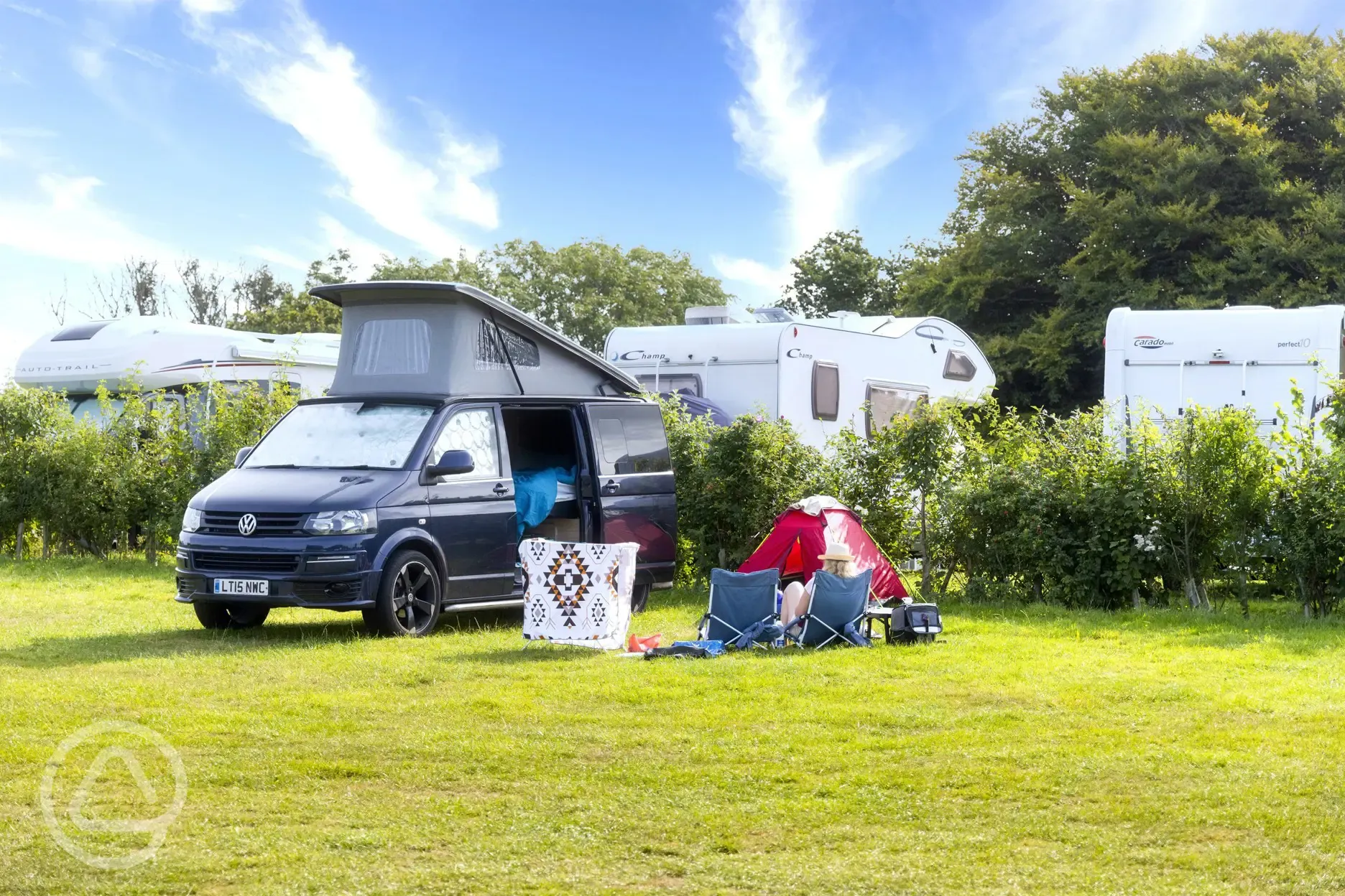 Non electric grass pitch with a VW campervan