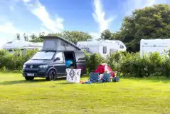 Non electric grass pitch with a VW campervan