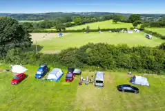 Grass pitches (optional electric) by the hedged borders of the field