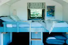 Caping pod with a double bed and two futon beds Caping pod with a double bed and two futon beds