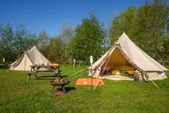Dog friendly bell tents with fire pits and a picnic bench Dog friendly bell tents with fire pits and a picnic bench