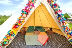 Bell tent with a double bed and bedding Bell tent with a double bed and bedding