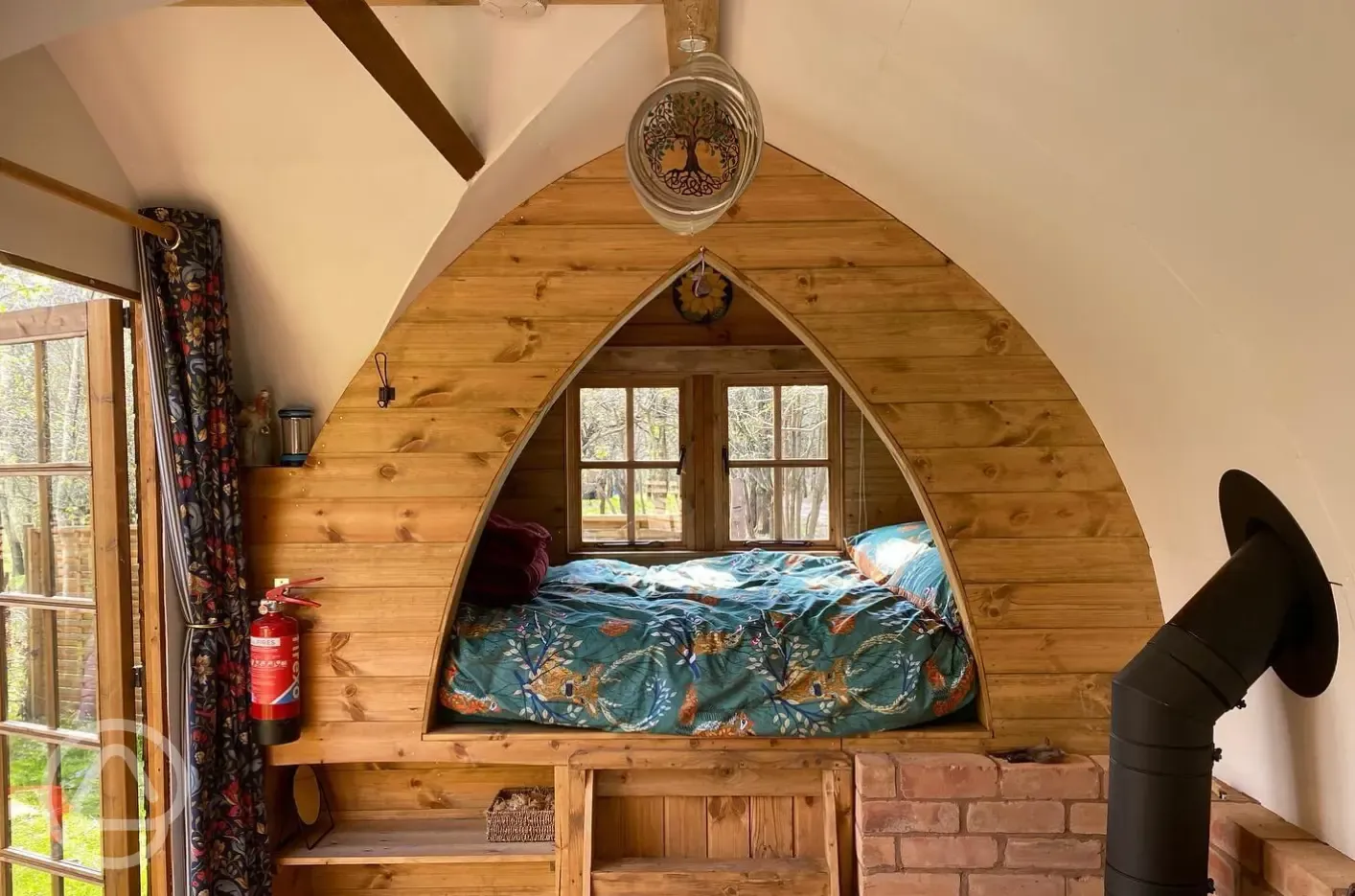 Glamping shepherd's hut interior with a double bed