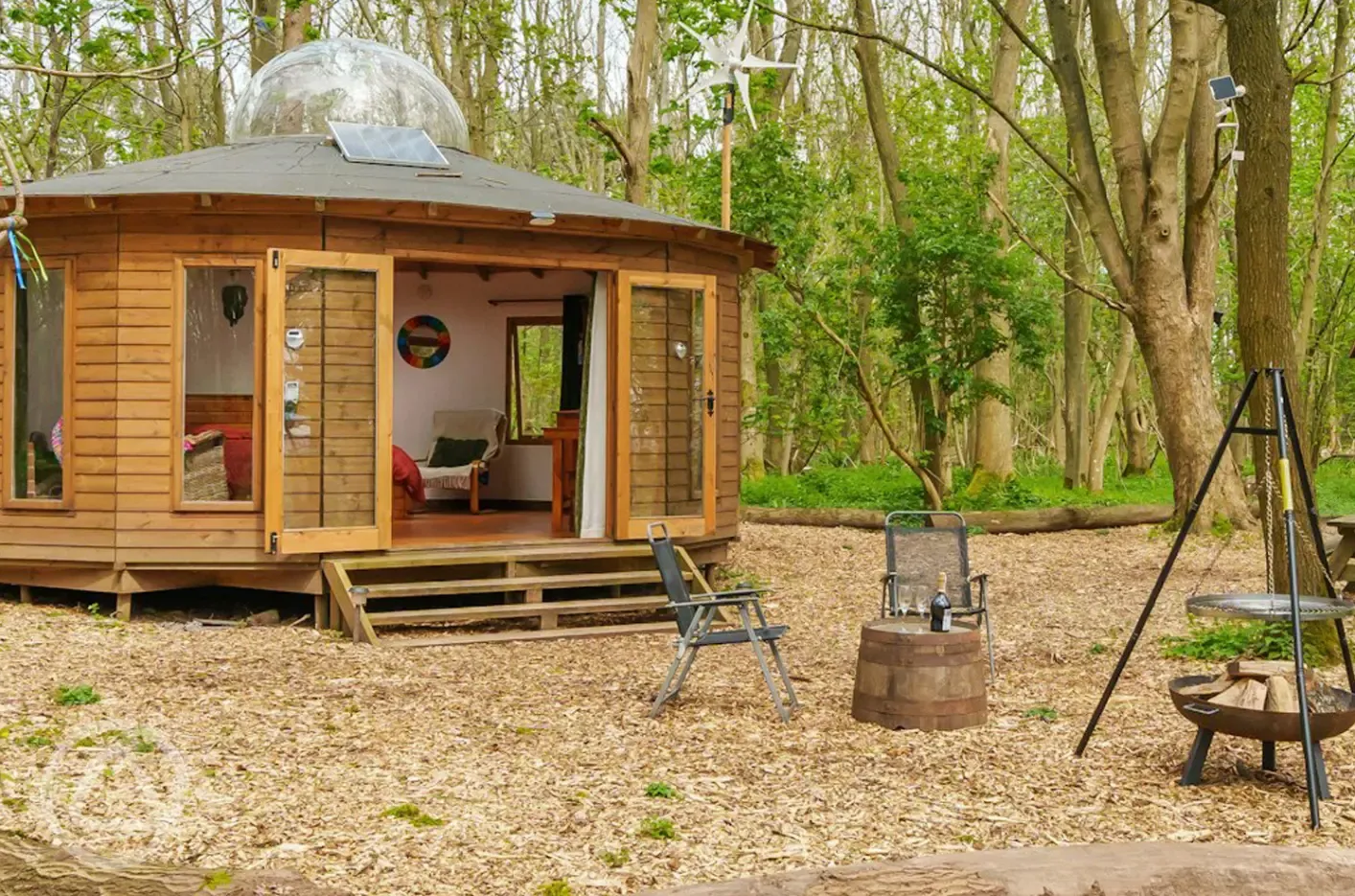 Roundhouse wooden yurt with fire pit