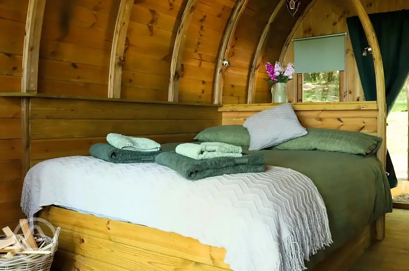 Glamping pod interior with double bed