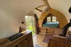 Glamping shepherd's hut interior with a double bed Glamping shepherd's hut interior with a double bed