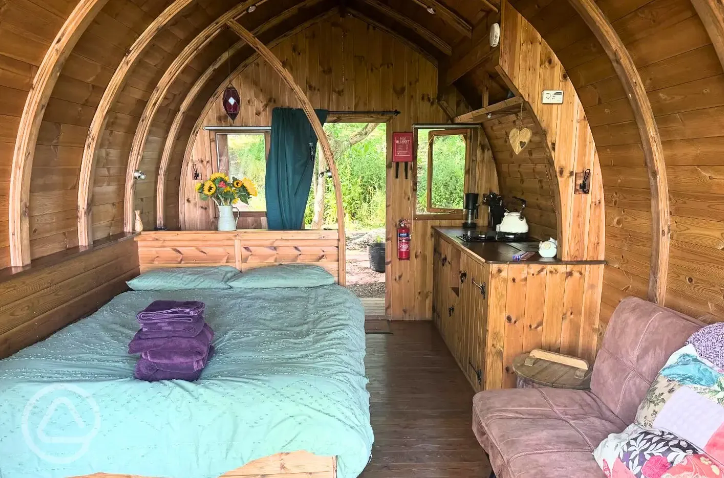 Glamping pod interior with double bed