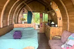 Glamping pod interior with double bed Glamping pod interior with double bed