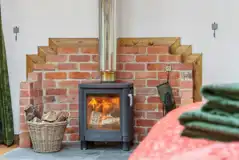 Roundhouse wooden yurt interior with a wood burner Roundhouse wooden yurt interior with a wood burner