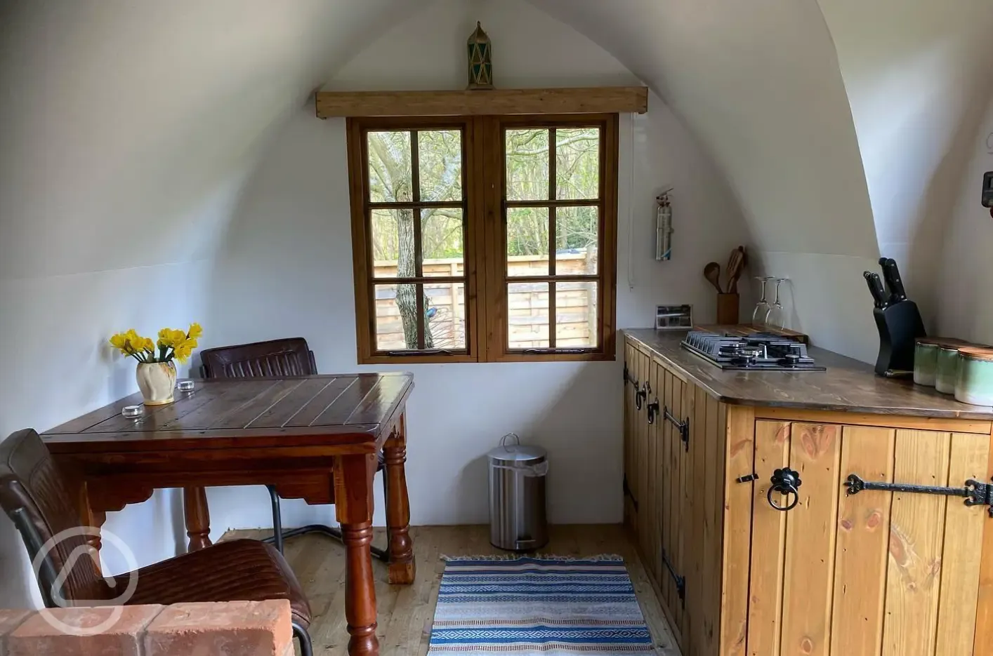 Glamping shepherd's hut kitchen and dining area
