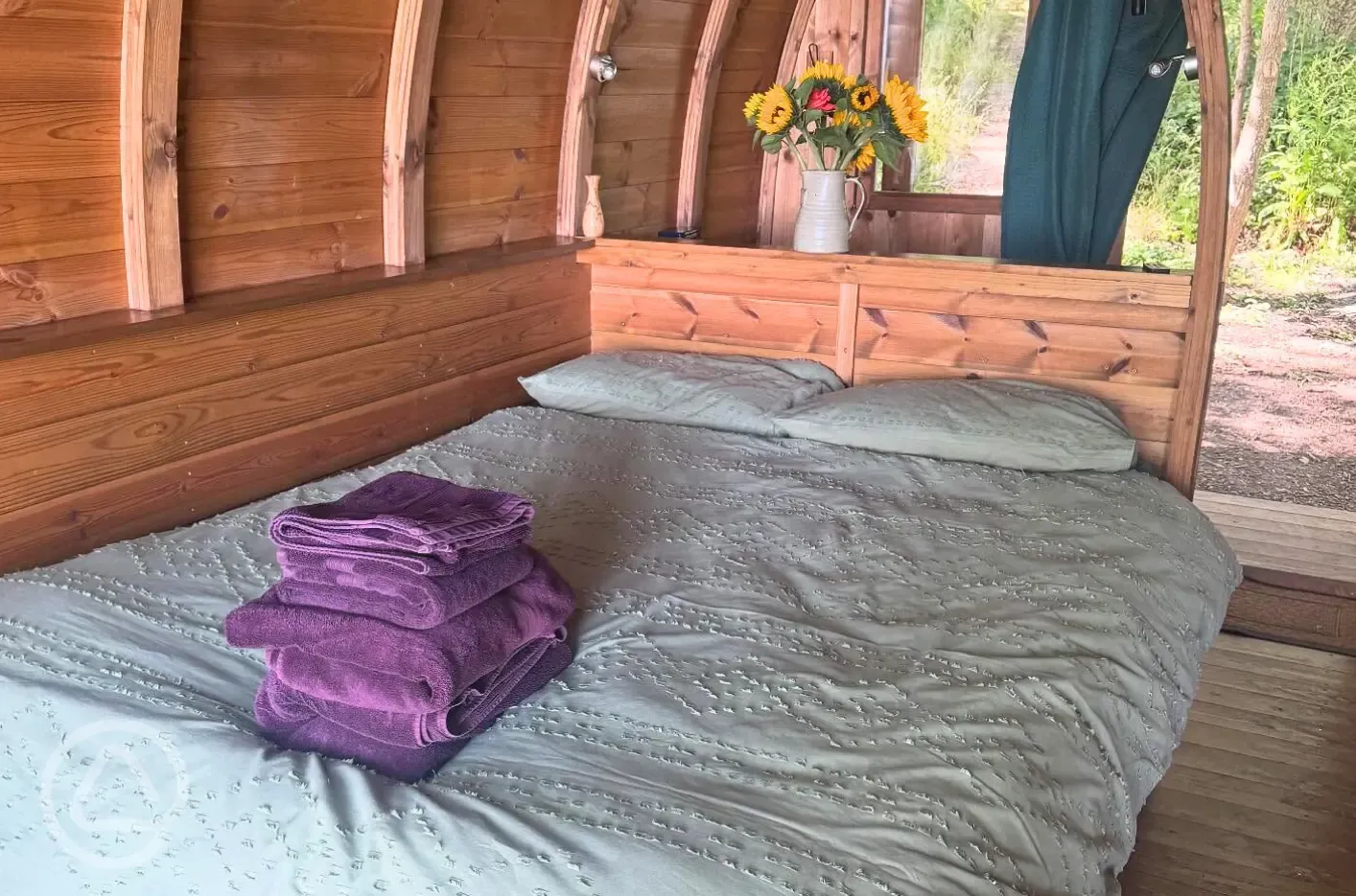 Glamping pod interior with double bed