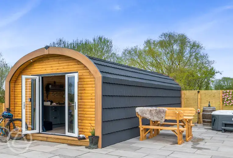 Glamping pod with an electric hot tub at Dwell On The Moor