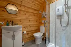 Ensuite glamping pod bathroom with toilet and shower Ensuite glamping pod bathroom with toilet and shower