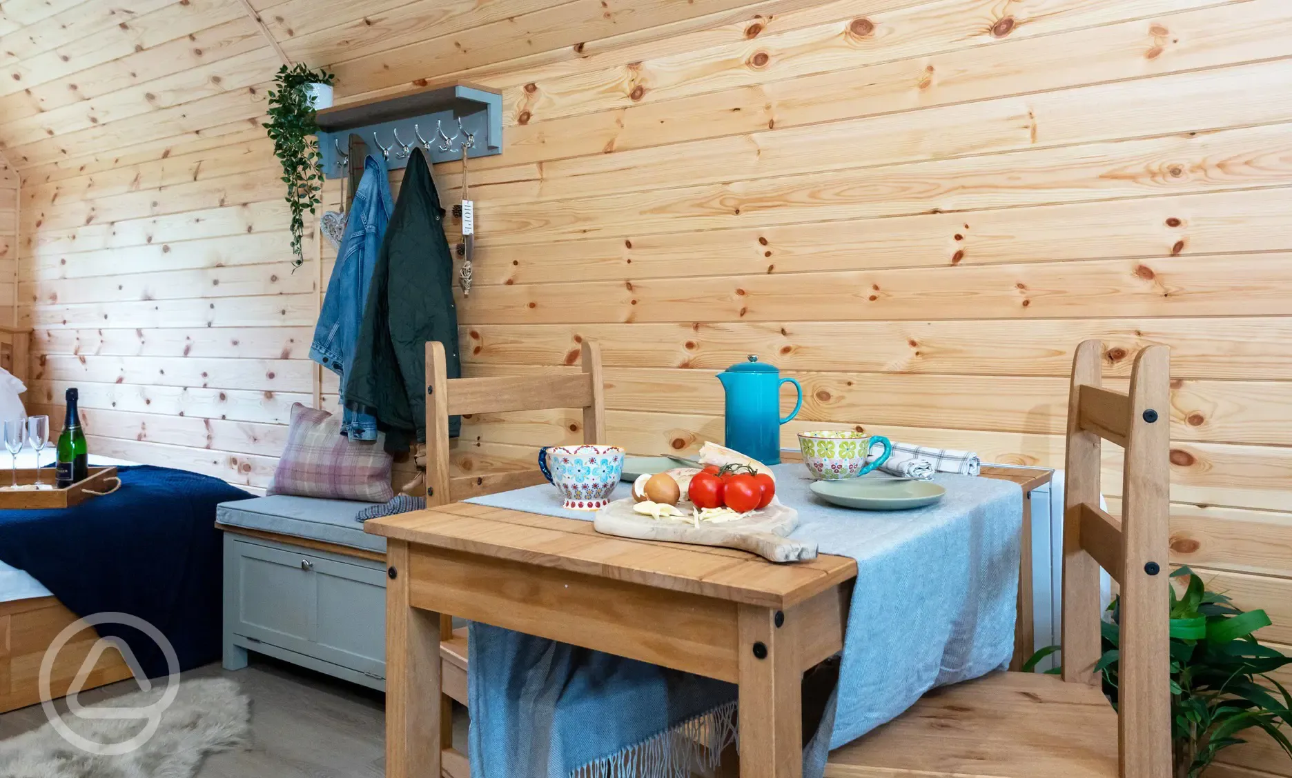 Glamping pod with hot tub dining area