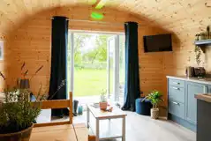 Glamping pod with hot tub living area