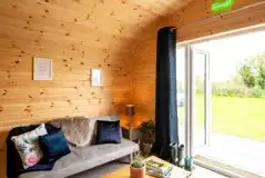 Glamping pod with hot tub living area