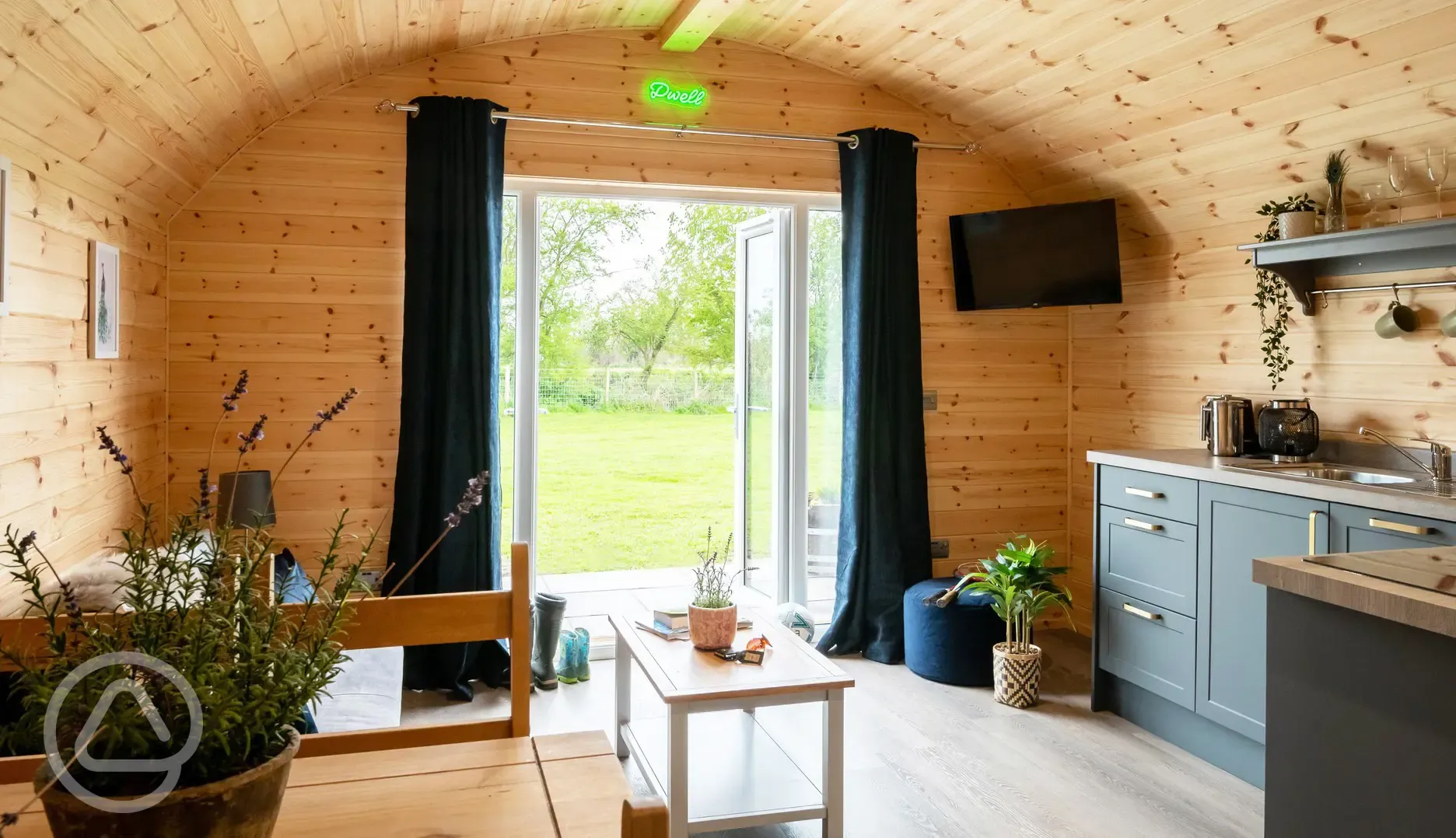 Glamping pod with hot tub living area